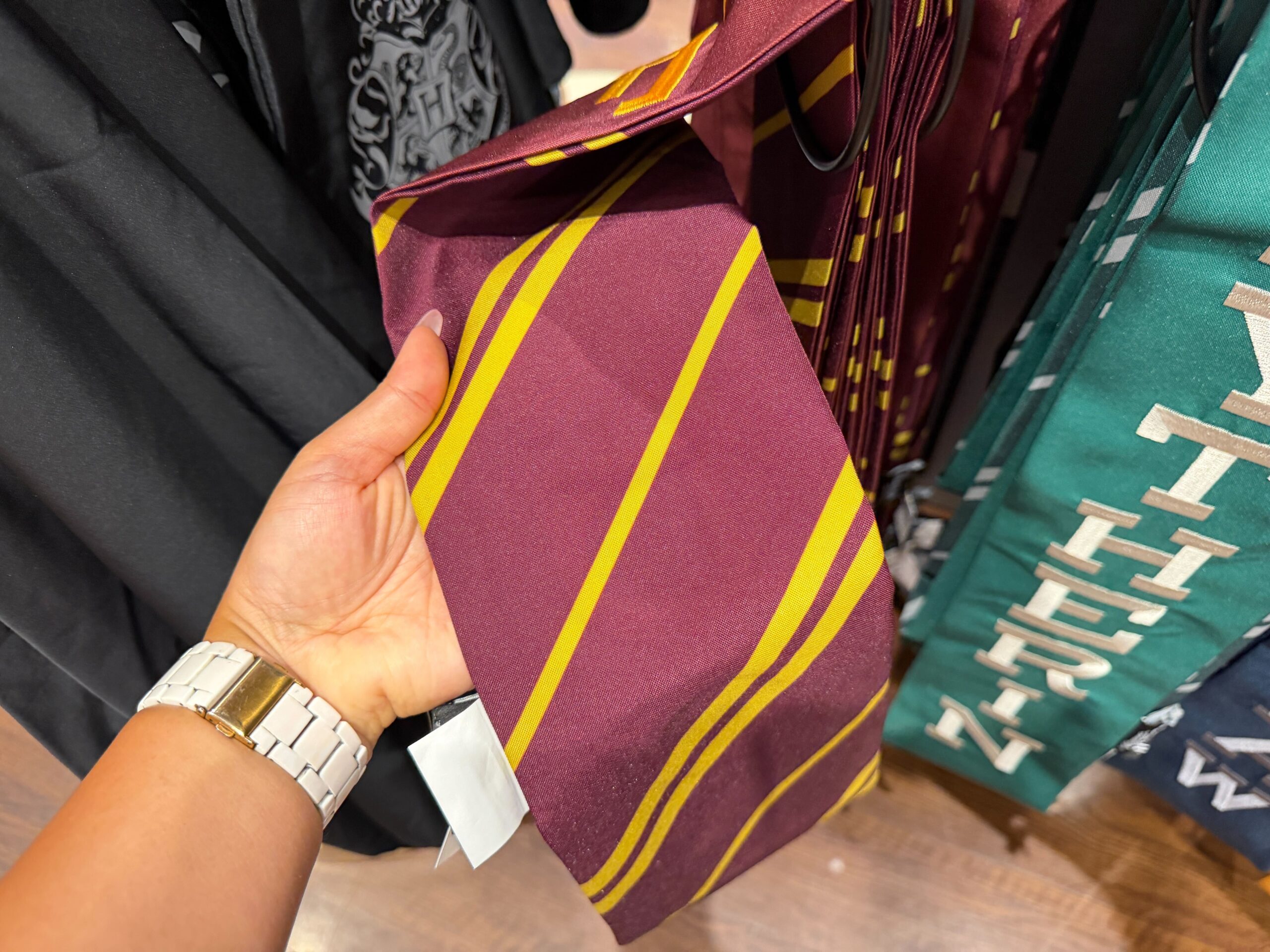 Multiple Hogwarts house stoles arranged to show all four house options